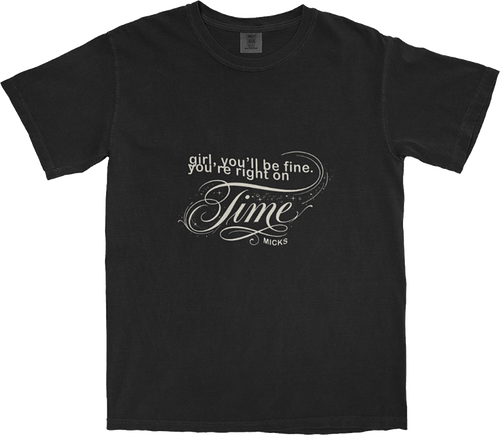 Washed black t-shirt with white text reading: 'girl, you'll be fine, you're right on time' in a stylised graphic layout.