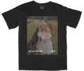 Washed black t-shirt featuring the official 'girl, you'll be fine' single cover art by Micks. The design includes the song title and desert-inspired imagery.